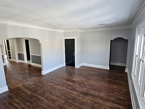 2nd view of the family room showing the adjacent dining room, closet and entrance to the upper level porch.