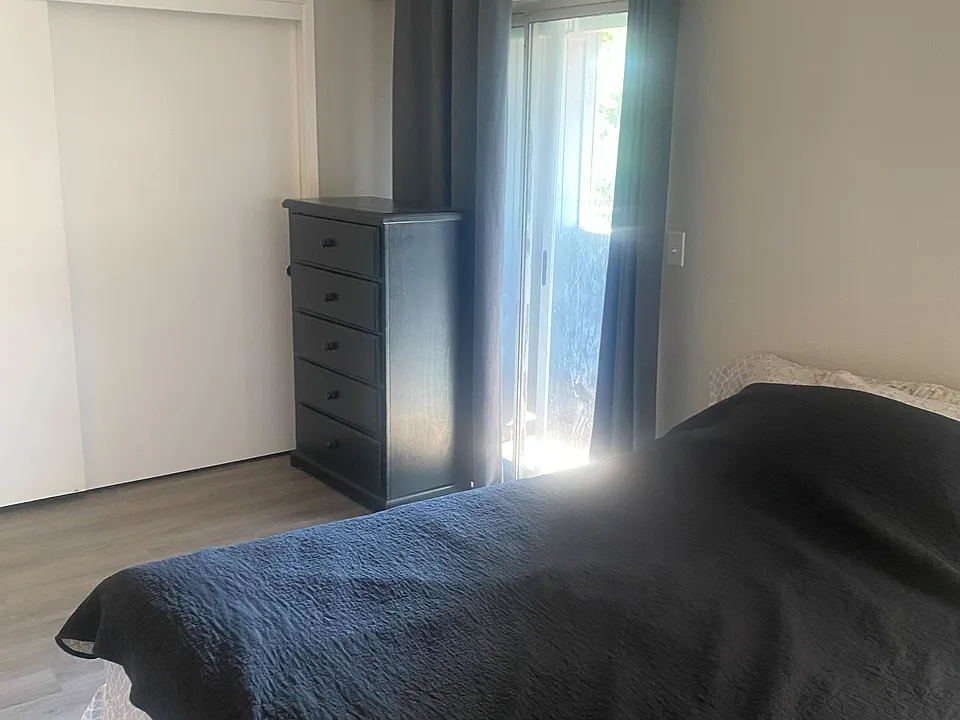 Master bedroom with private balcony, upstairs.