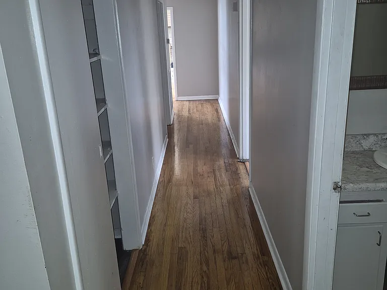 hallway to bedrooms and living room