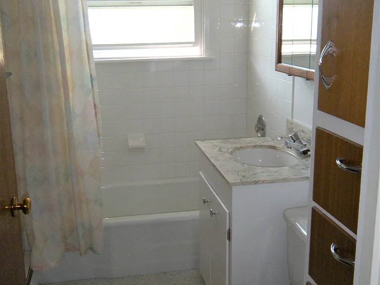 The full bath is off the hallway with the bedrooms
