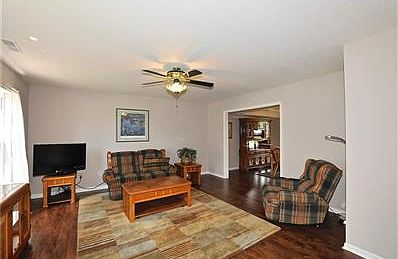 This view of the living room demonstrates how large and open the space is.  You could use it as a library or office too!