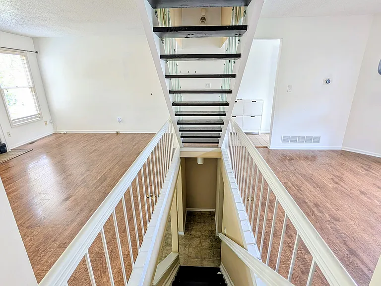Stairs going down to basemen, open access