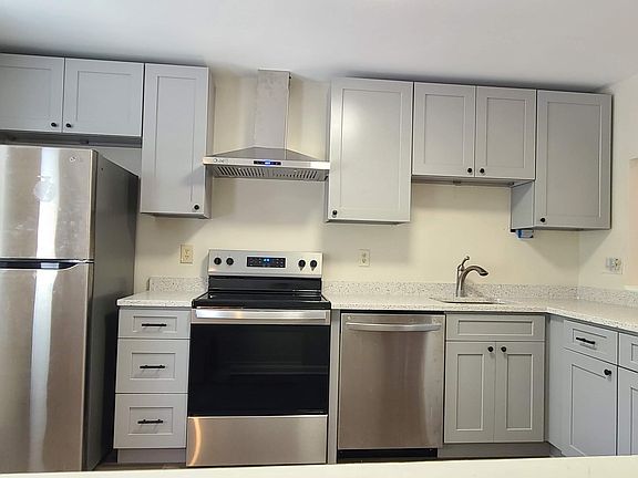 New kitchen with quartz countertop.