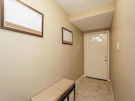 Tile floors welcome you into the entry and guide you to the inviting family room.