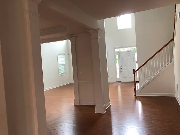 another view of the living room/dinning room/hallway