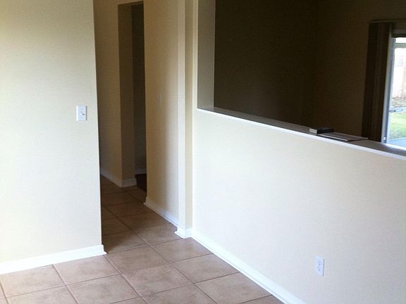 Dining room opening to living room & doorway to kitchen