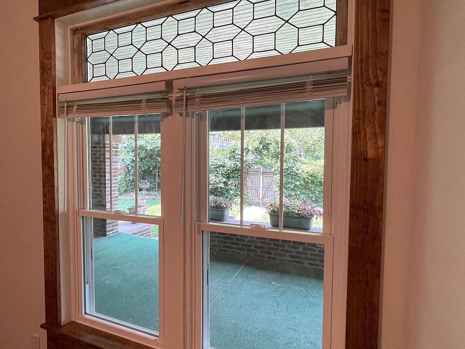 Matching, antique leaded glass transoms in bedroom and living room