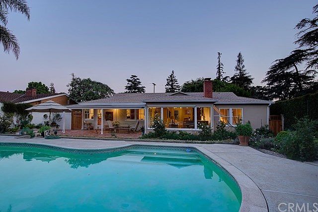 Spectacular twilight view of the house from the pool...charming!
