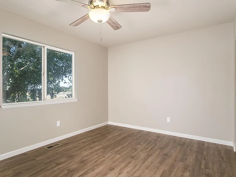 Master bedroom w/ fresh paint and new LVP flooring