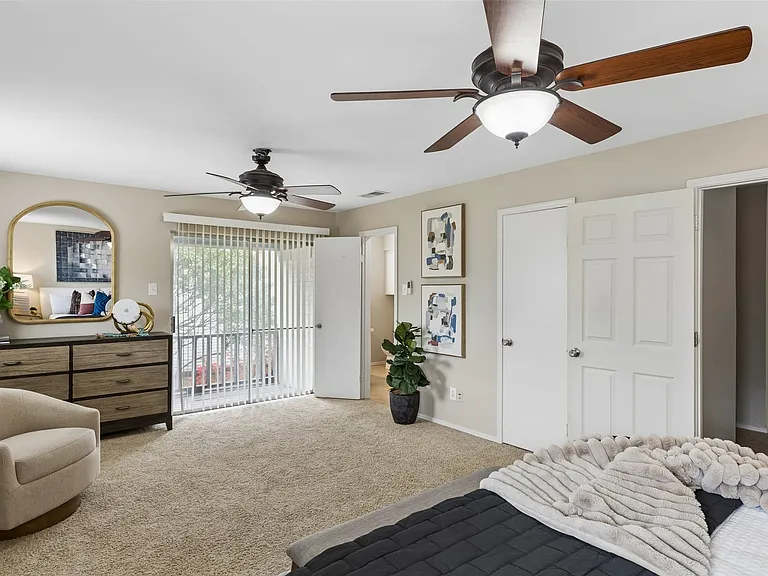 The primary bedroom has two walk-in closets and an en-suite bathroom.