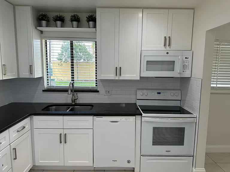 KITCHEN,
VIEW FROM LIVING ROOM.