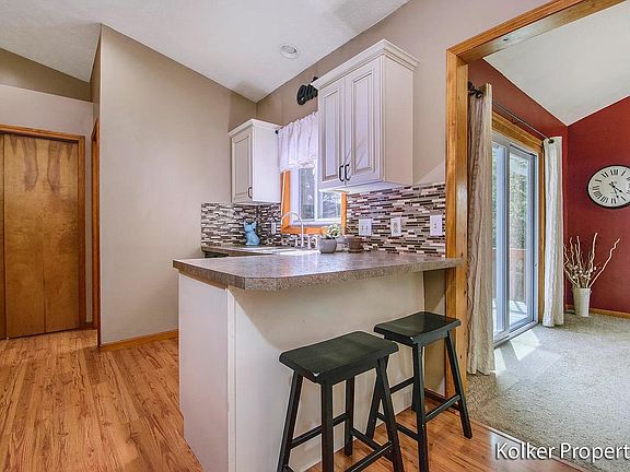 Kitchen area with barstool seating