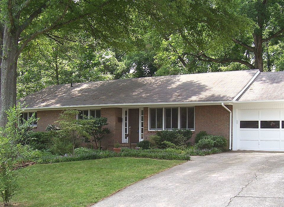 This full brick ranch home has a warm, wonderfully renovated interior.