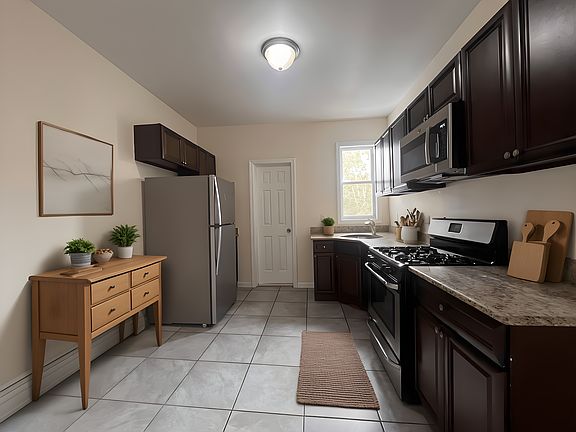 virtually staged kitchen - ample space for a dining table and 4 chairs