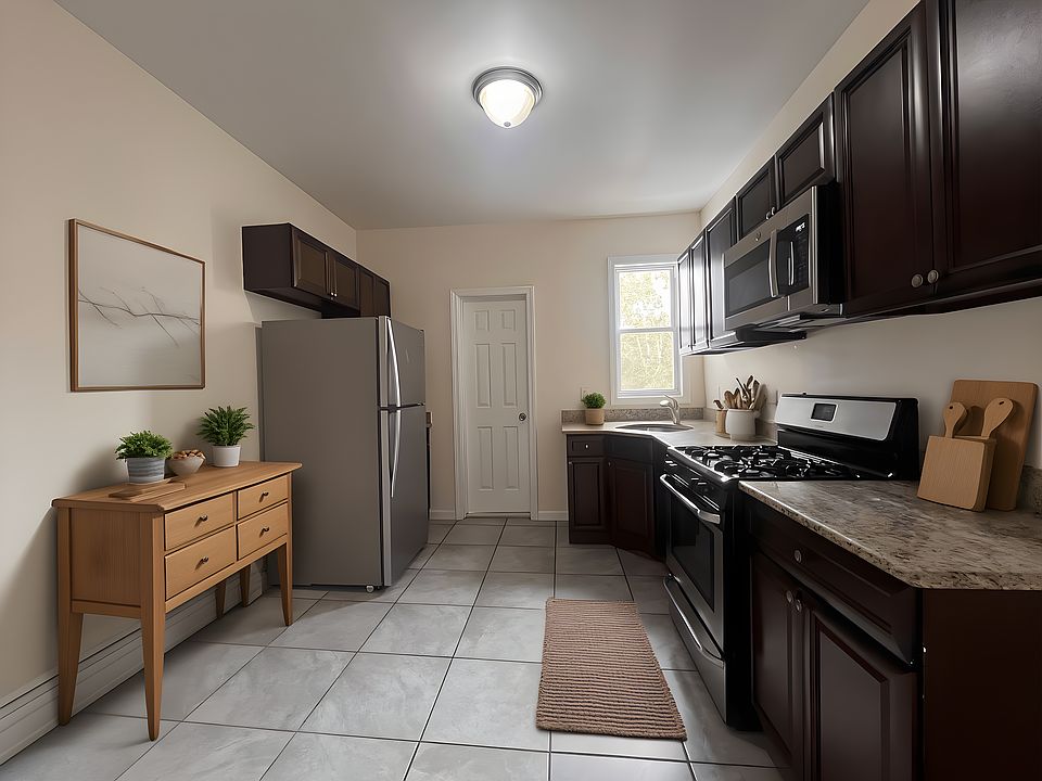 virtually staged kitchen - ample space for a dining table and 4 chairs
