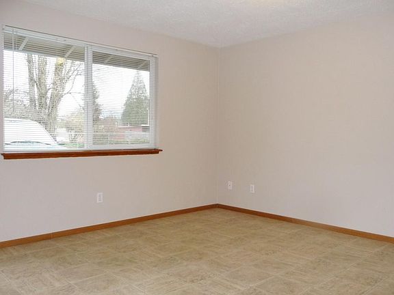 Good sized living room is light and bright. This compact apartment has a great floor plan and is comfortable.