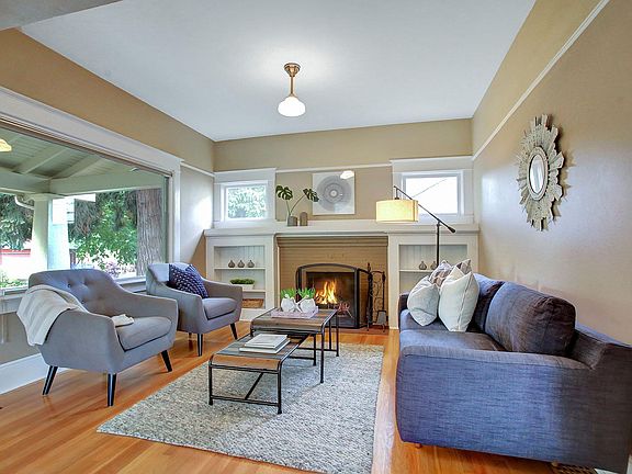 Living room with large picture window, working fireplace (wo