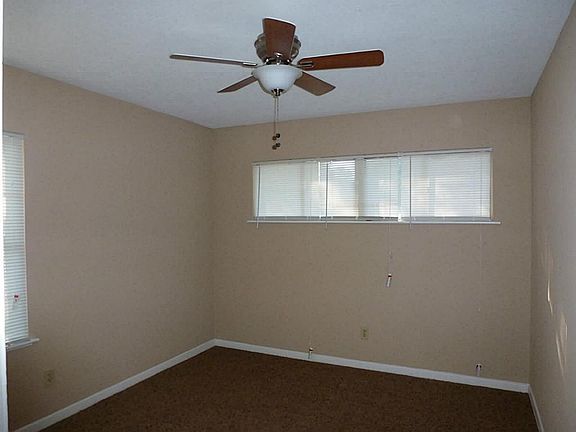 Bedroom  number one has new carpet, paint, blinds and last but not least a new ceiling fan