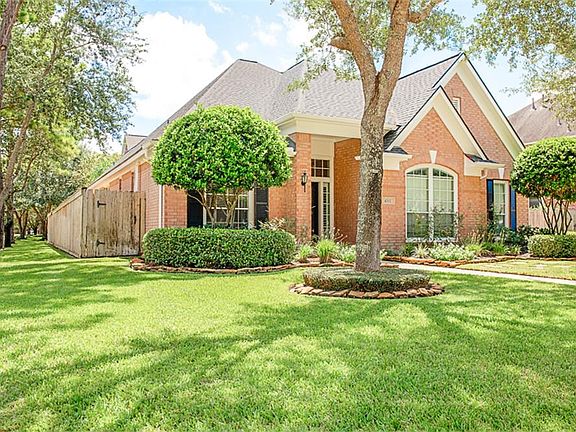 Pristine corner lot with mature trees.