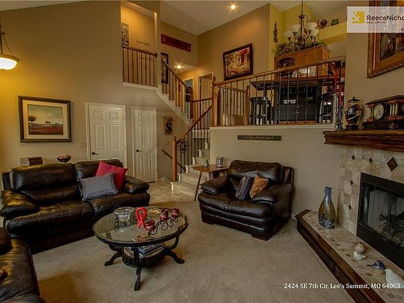 FORMAL LIVING ROOM WITH SOARING VAULTED CEILINGS