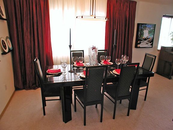 Generous formal dining area easily seats 8 and offers a view of Mount Rainier through the window.