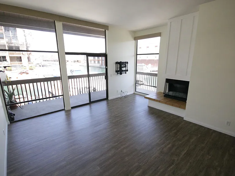 Stepdown Livingroom with Gas Fireplace & Private Waterfront Balcony! HOA allows the use of Barbeques!