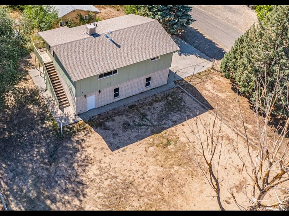 Two story home with 1/4 acre on highway. First story is large two car garage, office and bedroom areas