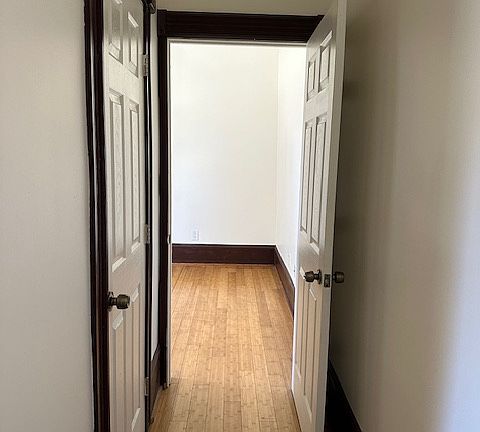Hallway to Bedroom. Bathroom door on the left.