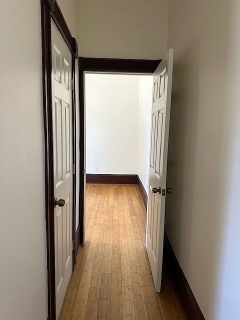 Hallway to Bedroom. Bathroom door on the left.