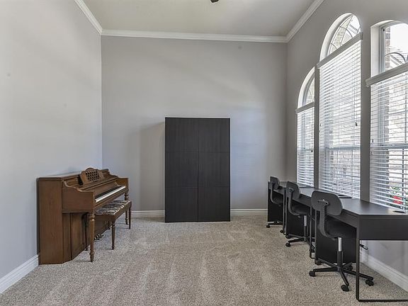 Formal Living Room features arched windows.