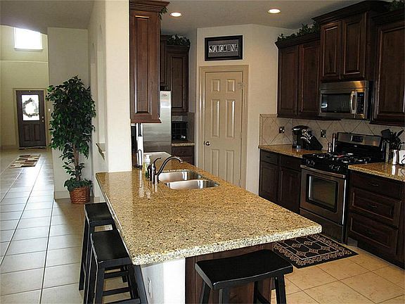 The OPEN design of this plan is PERFECT for entertaining as well as quiet evenings at home!  The island kitchen overlooks the family room and allows the chef of the home to engage with all of the household happenings!