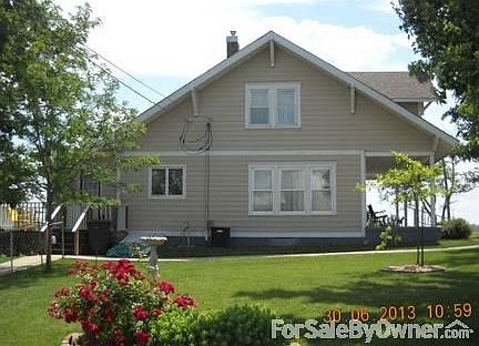 side yard and 4 bedroom home