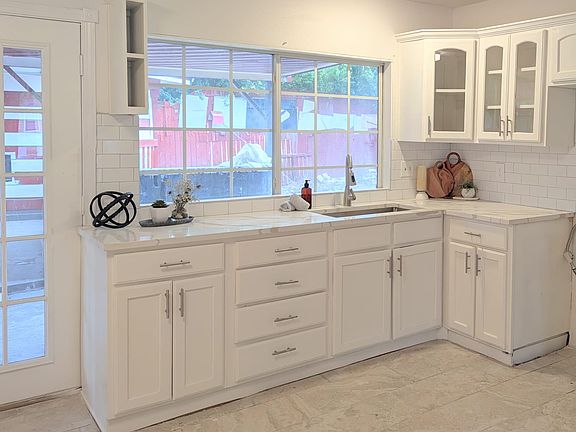 Kitchen sink with view of the spacious backyard.