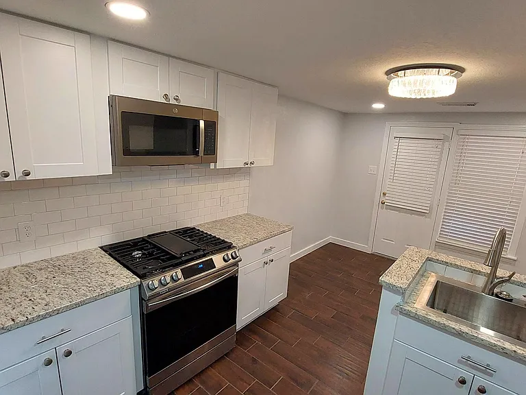 Gas Stainless stove/over with vented Microwave.