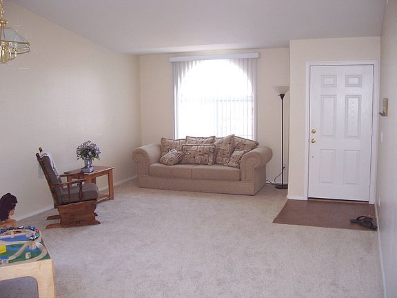 FORMAL LIVING AND DINING IN FRONT OF HOME WITH VAULTED CEILINGS