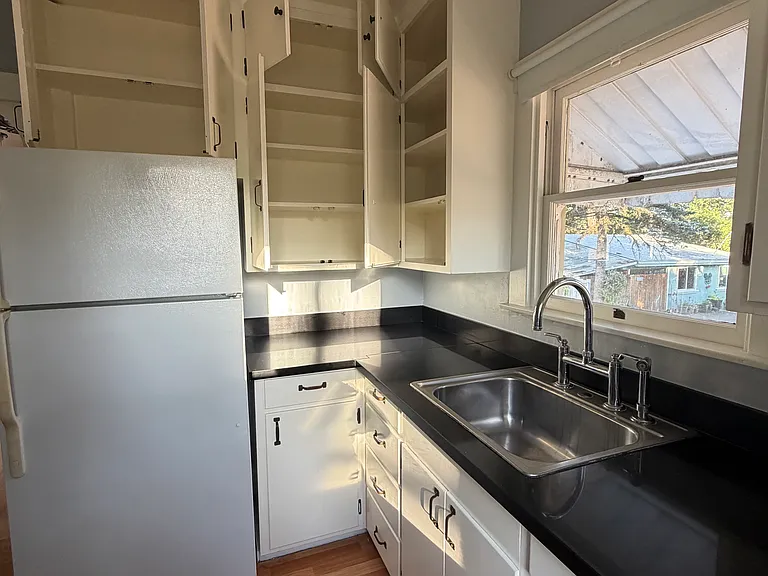 The cheery kitchen gets great light.