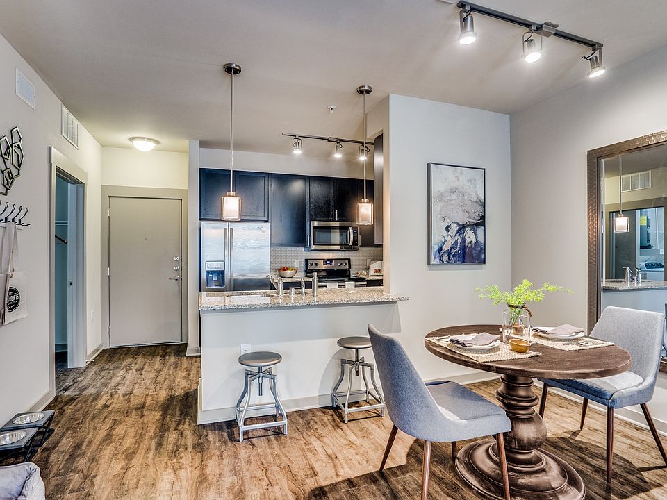 modern dining room with wood plank flooring