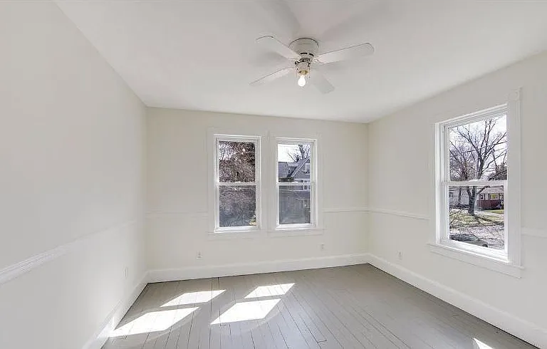 Bedroom 2 - front of house with custom shelving in closet