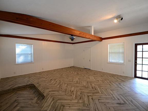 Gorgeous tilework throughout the living areas and look at how much character those wood beams provide!
