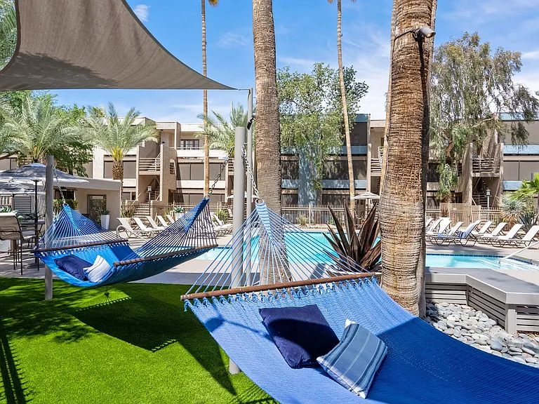 Drift away in a blissful slumber, nestled in the poolside hammock garden under swaying palms. Find your joy on our expansive pooldeck!