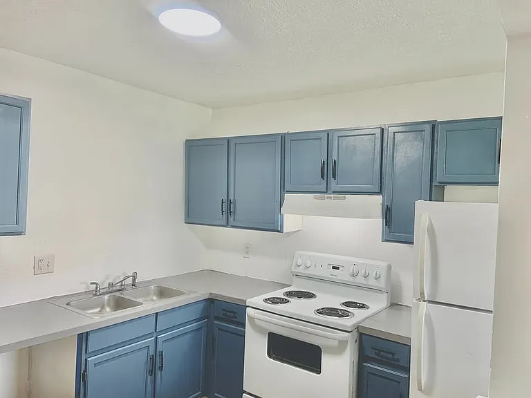 Love the fresh paint and new hardware on kitchen cabinets