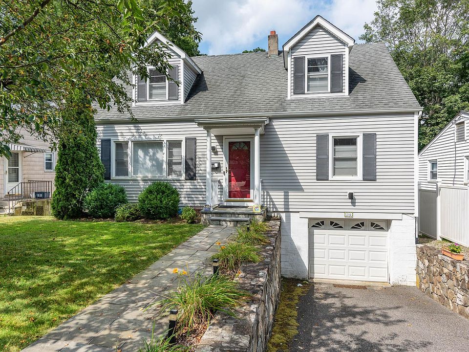 Cheerful, expanded cape with easy walk in access (only 2 steps), driveway, and one car garage. On street parking available, too.