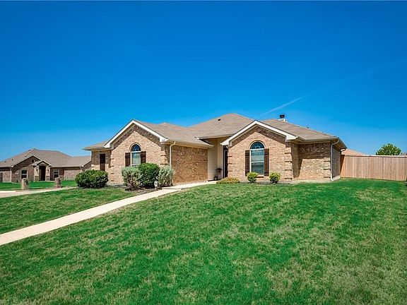 The oversize corner lot provides a lovely set back from the sidewalk