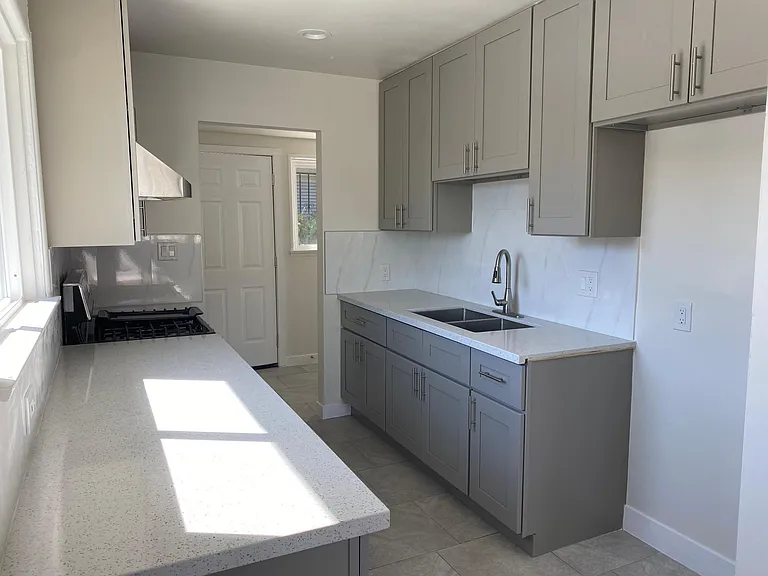 Kitchen w/ view of laundry room & back door