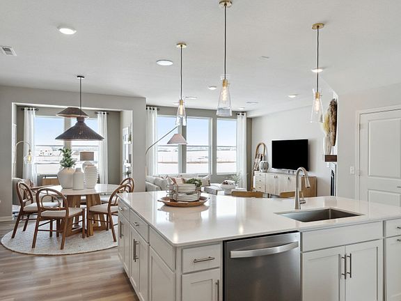 Gazing into the kitchen, sunroom, dining room, and gathering room