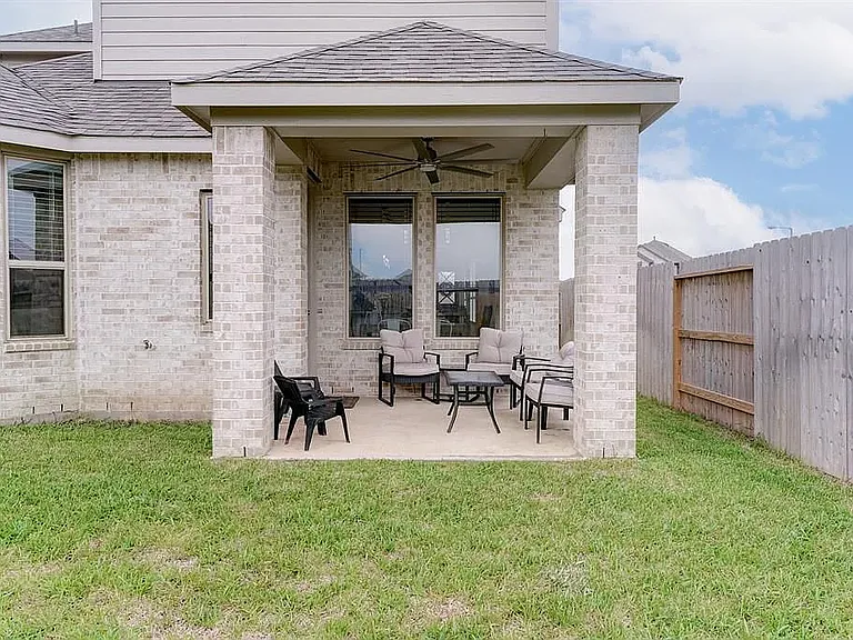 A nice patio to unwind, with a large ceiling fan to keep the air moving!