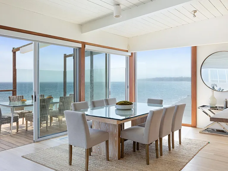The open floor plan makes going from the dining room to the family room easy.
Dine inside or outside, always with a spectacular view and calm setting.