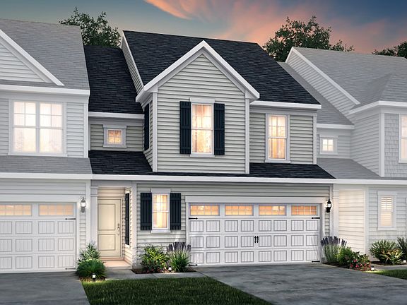 Palomino Exterior 4 features siding, covered front door and 2-car front load garage