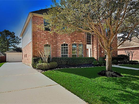 Detached over-sized garage allows for organized storage of your belongings, sports toys & pool equipment.