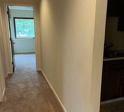 Hallway from living room to bedrooms and laundry